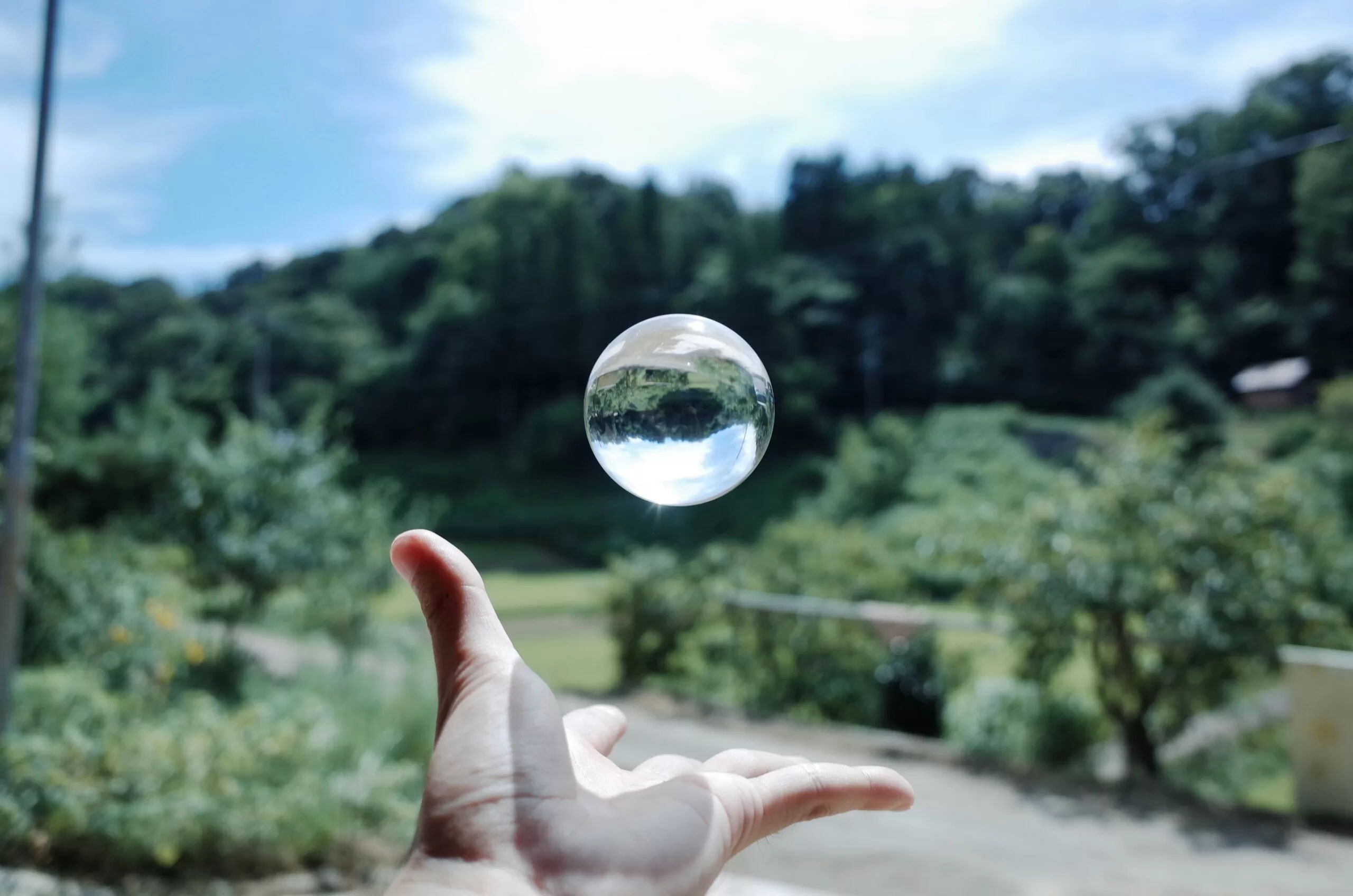 A clear glass ball resting on a surface