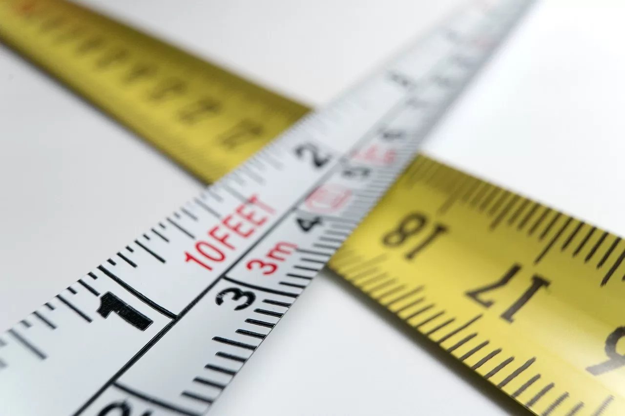A tape measure and ruler, illustrating measurement